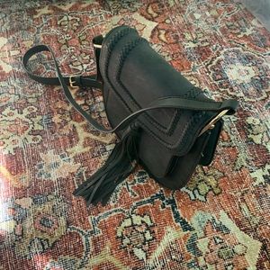 Leather Handbag with braided detail and sash.